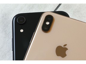 FILE- This Oct. 22, 2018, file photo shows the iPhone XR, left, that has a single lens, and the iPhone XS Max that has two lenses, in New York. Wall Street expects that Apple's latest quarterly snapshot will show mixed results. Financial analysts predict the technology giant's fiscal first-quarter earnings rose from a year earlier, while revenue declined. Apple serves up its results for the October-December quarter on Tuesday, Jan. 29.