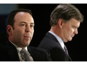 FILE- In this Nov. 17, 2004, file photo Kmart chairman Edward Lampert, left, and Sears CEO Alan Lacy listen during a news conference to announce the merger of Kmart and Sears in New York. As Sears teeters on the brink of collapse, there's one man at the center of the fight for the future of the iconic retailer. Lampert plays several, often conflicting, roles in what could be the final chapter for the company that began as a mail order watch business 132 years ago. He's been chairman, CEO, landlord, lender, and largest shareholder all at the same time. If the company survives, he wins. If it ends up liquidating, he also wins.