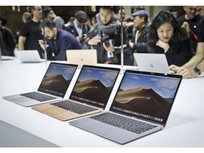 FILE- In this Oct. 30, 2018, file photo Apple's new MacBook Air computers are displayed during the company's showcase of new products in the Brooklyn borough of New York. Apple Inc. reports earnings Tuesday, Jan. 29, 2019.