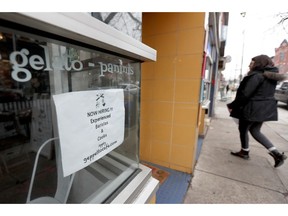 In this Friday, Jan. 4, 2019, photo a job opening sign is displayed in a window at a cafe in in Pittsburgh's Lawrenceville neighborhood. On Tuesday, Jan. 8, 2019, the Labor Department reports on job openings and labor turnover for November.