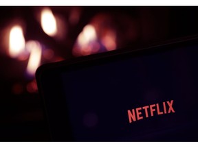 FILE- This Tuesday, Jan. 17, 2017, photo, shows Netflix on a tablet, in North Andover, Mass. Netflix reports financial results Thursday, Jan. 17, 2019.