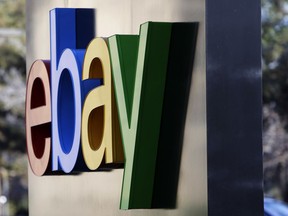 FILE - This Jan. 14, 2015, file photo, shows signage at the entrance to eBay's headquarters in San Jose, Calif. An activist shareholder is telling eBay that restructuring its business could help more than double its stock price. Investment firm Elliott Management, which owns more than 4 percent of eBay stock, said in a letter sent to eBay Inc.'s board that enacting the recommendations could lead eBay's stock to be valued at $55 to more than $63 per share by the end of next year. The stock closed at $31 on Friday, Jan. 18, 2019.