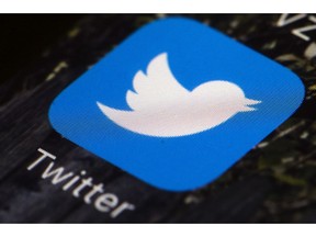 FILE - This April 26, 2017, file photo shows the Twitter app icon on a mobile phone in Philadelphia. Reporters at the online news site Insider have been told to take a week off from tweeting at work and to keep TweetDeck off their computer screens. The idea of disengaging is to kick away a crutch for the journalists and escape from the echo chamber, said Julie Zeveloff West, Insider's editor-in-chief for the U.S.