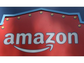 FILE - This Oct. 23, 2018, file photo shows an Amazon logo atop the Amazon Treasure Truck The Park DTLA office complex in downtown Los Angeles. Amazon has eclipsed Microsoft as the most valuable publicly traded company in the U.S. as a see-sawing stock market continues to reshuffle corporate America's pecking order. The shift occurred Monday, Jan. 7, 2019, after Amazon's shares rose 3 percent to close at $1,629.51 and lifted the e-commerce leader's market value to $797 billion.