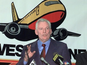 FILE - In this Dec. 9, 1998, file photo, Southwest Airlines President and CEO Herb Kelleher speaks at a news conference at MacArthur Airport in Islip, N.Y. Not many CEOs dress up as Elvis Presley, settle a business dispute with an arm-wrestling contest, or go on TV wearing a paper bag over their head. Southwest confirmed Kelleher died on Thursday, Jan. 3, 2019. He was 87.