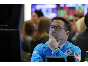 nullFILE- In this Jan. 10, 2019, file photo, specialist Paul Cosentino works on the floor of the New York Stock Exchange. The U.S. stock market opens at 9:30 a.m. EST on Monday, Jan. 14.