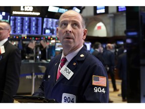 FILE- In this Dec. 27, 2018, file photo trader Michael Urkonis works on the floor of the New York Stock Exchange. The U.S. stock market opens at 9:30 a.m. EST on Thursday, Jan. 31.