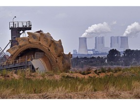 File--- In this photo taken Aug. 27, 2018  bucket wheel digs for coal near the Hambach Forest near Dueren, Germany.