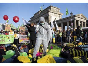 Demonstrators protest formore animal welfare and protection in the agriculture on occasion of the "Green Week" fair in front of the Brandenburg Gate in Berlin, Germany, Saturday, Jan. 19, 2019.