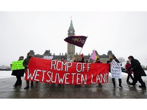 Protesters voice their opposition against pipelines during a rally on Parliament Hill in Ottawa on Tuesday, Jan. 8, 2019. Dozens of rallies are planned in British Columbia, across Canada and as far away as Europe to support pipeline protesters arrested in northwestern B.C.
