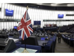 A British flag is pictured at the European Parliament during a debate on Brexit, Wednesday, Jan.16, 2019 in Strasbourg. European Union Brexit negotiator Michel Barnier says the bloc is stepping up preparations for a chaotic no-deal departure of Britain from the bloc after the rejection of the draft withdrawal deal in London left the EU "fearing more than ever that there is a risk" of a cliff-edge departure.