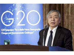 Bank of Japan Gov. Haruhiko Kuroda delivers a speech at a symposium in Tokyo Thursday, Jan. 17, 2019. Kuroda warned of unforeseen risks in guiding economic policy as the country's population declines. (Kyodo News via AP)