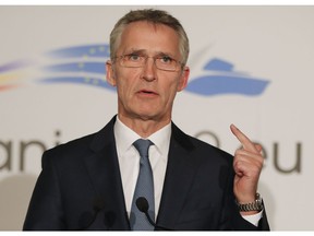 NATO Secretary-General Jens Stoltenberg gestures during media statements in Bucharest, Romania, Wednesday, Jan. 30, 2019.  Stoltenberg urged Russia to respect a major Cold War-era missile treaty saying its missiles are nuclear capable and could reach European cities.