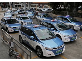 In this Monday, Jan. 7, 2019, photo, new electric-powered taxis are seen in Shenzhen city, south China's Guangdong province. One of China's major cities has reached an environmental milestone, an almost all electric-powered taxi fleet. The high-tech hub of Shenzhen in southern China announced at the start of this year that 99 percent of the 21,689 taxis operating in the city were electric.