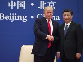 U.S. President Donald Trump and China's President Xi Jinping shake hands during a business leaders event. Perhaps there will be another upon a trade agreement.