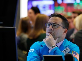 A specialist works on the floor of the NYSE. One political market analyst noted Thursday that the shutdown could reduce quarterly economic growth anywhere from 0.5 to 2 percentage points.