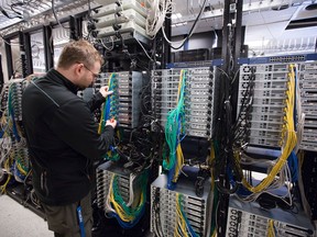 An engineer works on servers in a research and development cloud laboratory at Nokia in Ottawa. The federal government announced a $40-million investment in the company, some of which will go towards product improvement, cybersecurity tools development for telecommunications networks and 5G technology research.