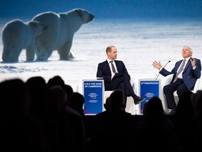 Prince William interviews David Attenborough while scenes from his new film, Planet Earth, are shown behind them.
