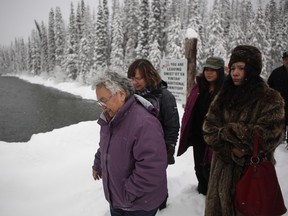 Supporters of the Unist'ot'en camp and Wet'suwet'en walk along a bridge over the Wedzin kwa River leading towards the main camp outside Houston, B.C., on Wednesday, January 9, 2019.