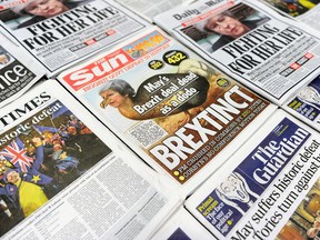 An arrangement of daily newspapers photographed in London on January 16, 2019 shows front pages reporting on the U.K. parliament's rejection of the government's Brexit deal.
