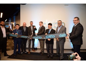 Canadian public officials MPP Pang and Councillor Alan Ho join Datto CEO Tim Weller and other Datto leaders to celebrate the grand opening of the new Datto office in Ontario.