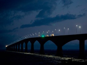 Trucks are seen crossing the Confederation bridge near Borden, P.E.I.