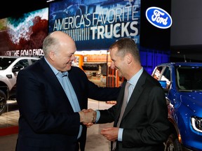Ford Motor Co. President and CEO, Jim Hackett, left, meets with Dr. Herbert Diess, CEO of Volkswagen AG, Monday, Jan. 14, 2019, at the North American International Auto Show in Detroit.