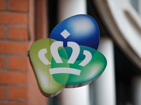 A logo sits on display outside the Royal KPN NV headquarters in The Hague, Netherlands.
