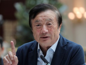 Ren Zhengfei, founder and CEO of Huawei, gestures during a round table meeting with the media in Shenzhen city, south China's Guangdong province, Tuesday, Jan. 15, 2019.