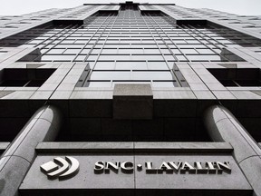 SNC-Lavalin Group Inc. dropped the most in at least 27 years after the builder warned it would miss its full-year profit target.