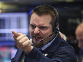 A trader works on the floor of the New York Stock Exchange on Friday.