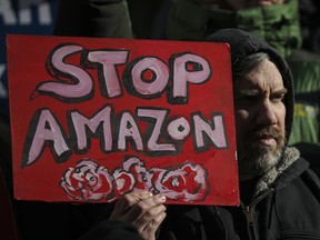 otestors rally against Amazon and the company's plans to move their second headquarters to the Long Island City neighborhood of Queens, at New York City Hall, January 30, 2019 in New York City.