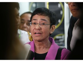 FILE - In this Jan. 22, 2018, file photo, Maria Ressa, CEO of the online news agency Rappler, talks to the media after attending the summons by the National Bureau of Investigation on the cyber libel complaint filed against Rappler five years ago in Manila, Philippines. Philippine authorities have arrested Ressa, Wednesday, Feb. 13, 2019, over a libel complaint which Amnesty International has condemned as "brazenly politically motivated."