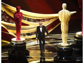 Michael Keaton walks on stage to present the award for best film editing at the Oscars on Sunday, Feb. 24, 2019, at the Dolby Theatre in Los Angeles.