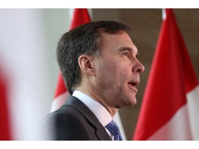 Federal Finance Minister Bill Morneau takes questions from the media during an announcement for Freedom Mobile at a press conference at the Delta Ocean Pointe in Victoria, B.C., on Friday, February 8, 2019.
