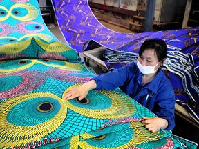 A worker at a textile factory in China. Canadian CEOs have soured on the promise of the country.