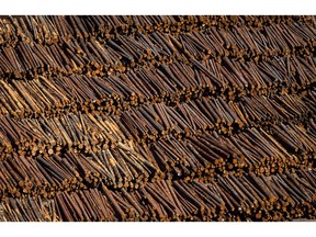 Logs are seen in an aerial view stacked at the Interfor sawmill, in Grand Forks, B.C., on May 12, 2018.