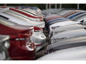 In this Sunday, June 24, 2018, photograph, unsold 2018 Elantra sedans sit at a Hyundai dealership in Littleton, Colo.