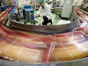 Packets of Catherdral City cheese move along the production line at the Dairy Crest factory in Nuneaton, U.K.