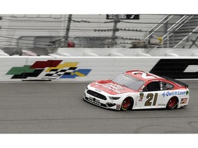 Paul Menard (21) leads the NASCAR Clash auto race on lap seven just before rain delayed the race at Daytona International Speedway, Sunday, Feb. 10, 2019, in Daytona Beach, Fla.