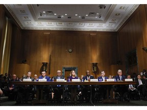 From l-r., Richard A. Gonzalez , Chairman and Chief Executive Officer AbbVie Inc., Pascal Soriot, Executive Director and Chief Executive Officer AstraZeneca, Giovanni Caforio, M.D. Chairman of the Board and Chief Executive Officer Bristol-Myers Squibb Co., Jennifer Taubert, Executive Vice President, Worldwide Chairman, Janssen Pharmaceuticals Johnson & Johnson, Kenneth C. Frazier, Chairman and Chief Executive Officer Merck & Co., Inc., Albert Bourla, DVM, Ph.D. Chief Executive Office Pfizer, Olivier Brandicourt, M.D. Chief Executive Officer Sanofi, prepare to testify before the Senate Finance Committee hearing on drug prices, Tuesday, Feb. 26, 2019 on Capitol Hill in Washington.