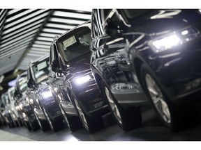 FILE - In this March 8, 2018 file photo photo Volkswagen cars are pictured during a final quality control at the Volkswagen plant in Wolfsburg, Germany. Germany's economic growth has stagnated in the last three months of the year.