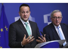 Irish Prime Minister Leo Varadkar, left, answers a question during a joint news conference with European Commission President Jean-Claude Juncker following their meeting at the European Commission headquarters in Brussels, Wednesday, Feb. 6, 2019.