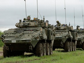 General Dynamics Land Systems Canada Lav 6 vehicles, like the ones being sold to Saudi Arabia, shown carrying troops.