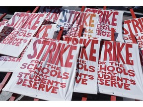 FILE - In this Feb. 21, 2019 photo picket signs are shown as teachers, students and supporters at a rally at Frank Ogawa Plaza in front of City Hall in Oakland, Calif. Teachers in Oakland hit the picket lines just as West Virginia teachers went back to class this week in a display of the national teacher unrest that in many places has moved beyond pay to politics, tackling issues like charter schools and vouchers.