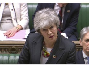 In this image taken from video, Britain's Prime Minister Theresa May gives a statement about progress on Brexit talks to members of parliament in the the House of Commons, London, Tuesday Feb. 12, 2019. Theresa May was urging restive lawmakers Tuesday to "hold their nerve" and give her more time to rework a divorce agreement with the European Union. (House of Commons/PA via AP)