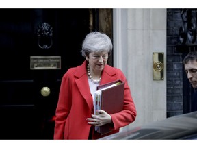 British Prime Minister Theresa May leaves 10 Downing Street in London, to attend Prime Minister's Questions at the Houses of Parliament, Wednesday, Feb. 27, 2019.