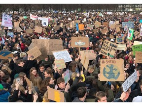 Some thousands of students gather to join a march in support of more ambitious climate policies in The Hague, Netherlands, Thursday Feb. 7, 2019. Organizers of the demonstration say they want to send a wake-up call to politicians in the Netherlands who are wrestling with how best to rein in greenhouse gas emissions.