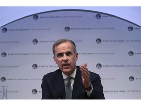 The Governor of the Bank of England, Mark Carney speaks during a news conference to confirm the main interest rate will remain at 0.75 percent, at the Bank of England in London, Thursday Feb. 7, 2019. The Bank of England said that Brexit uncertainties and a weaker global economy overall, mean that British growth in 2019 is likely to be 1.2 percent.