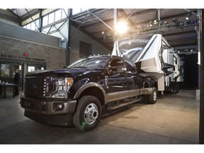 In a photo from, Wednesday, Jan. 30, 2019, in Detroit, a Ford F350 King Ranch truck is displayed at Eastern Market. All three Detroit automakers are rolling out new heavy-duty pickup trucks this year, courting buyers who tow heavy trailers for work or recreation. The introductions are sure to spark claims about horsepower, torque, towing capacity and payload hauling.